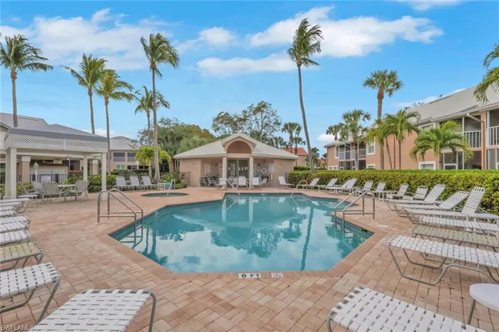 Community pool with a patio and a community hot tub