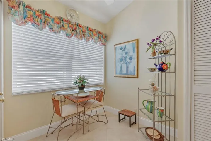 Tiled dining space with baseboards