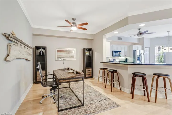 Office with crown molding, ceiling fan, light wood-style flooring, and recessed lighting