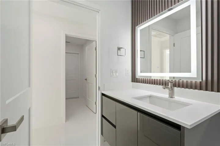 Bathroom with tile patterned flooring and vanity