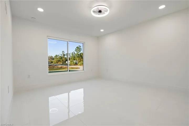Spare room with recessed lighting and light tile patterned floors