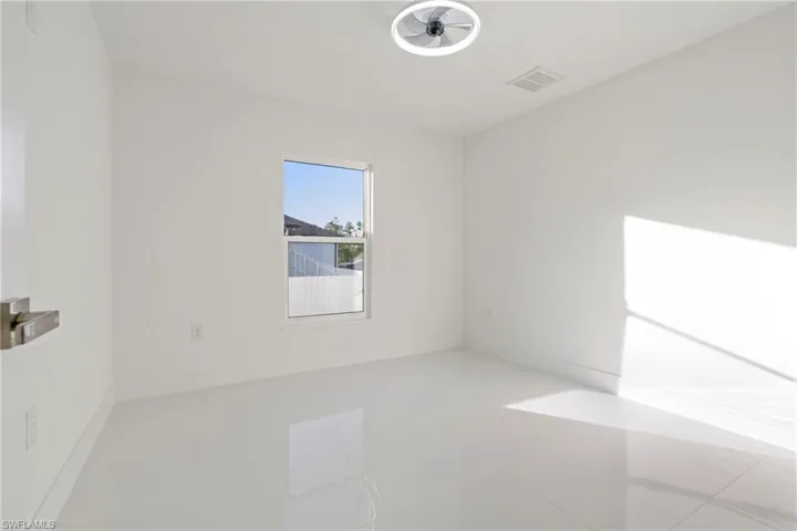 Spare room with light tile patterned floors