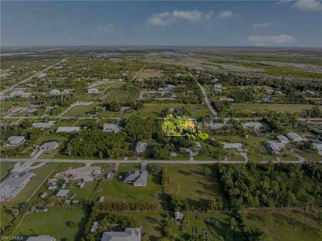 Aerial overview of property's location with nearby suburban area