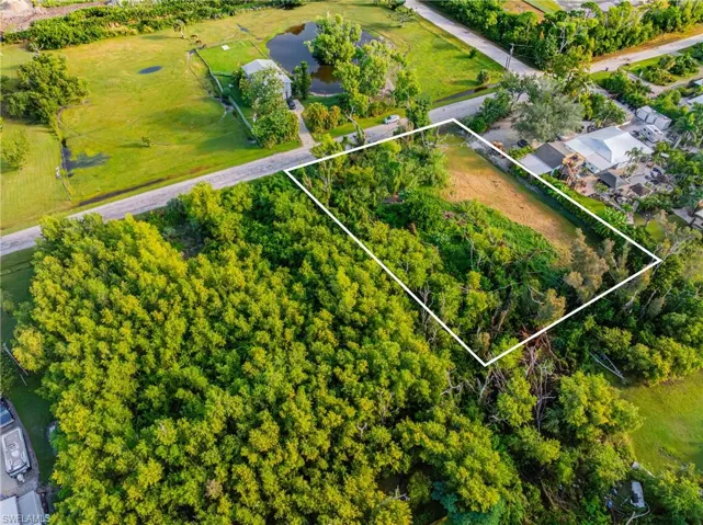 Aerial overview of property's location featuring property boundaries highlighted