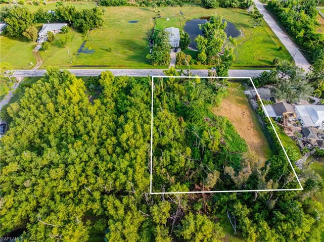 Aerial view of property's location featuring property parcel outlined