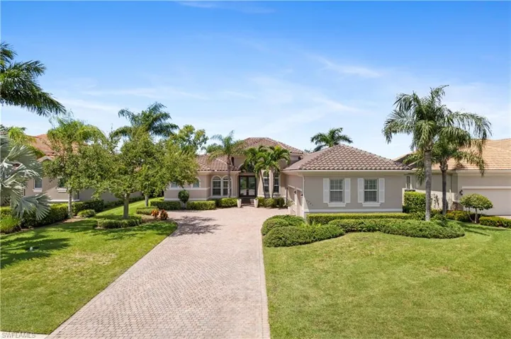 Mediterranean / spanish-style house featuring a front yard