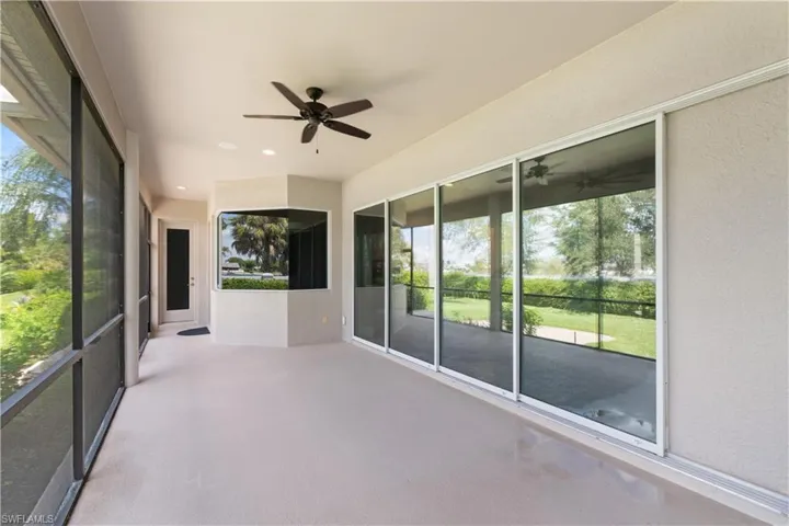 Large lanai featuring a healthy amount of sunlight and ceiling fan