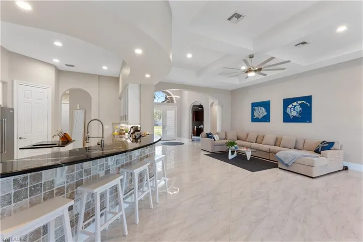 Many architectural elements including curved wall with recessed lighting