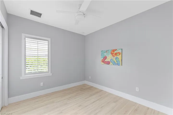 Unfurnished room featuring ceiling fan and light ceramic tile flooring