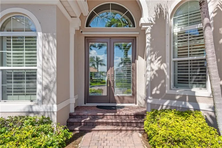 Doorway to property featuring double doors