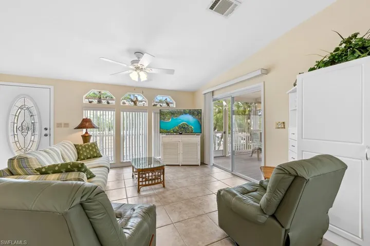 Tiled living room with ceiling fan