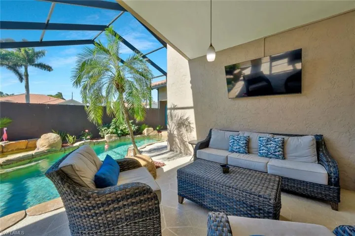 View of patio / terrace featuring outdoor lounge area, a fenced in pool, and screen enclosure