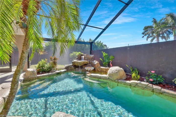View of pool with screen enclosure