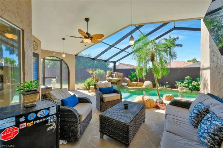 View of patio / terrace with a lanai, an outdoor hangout area, and ceiling fan