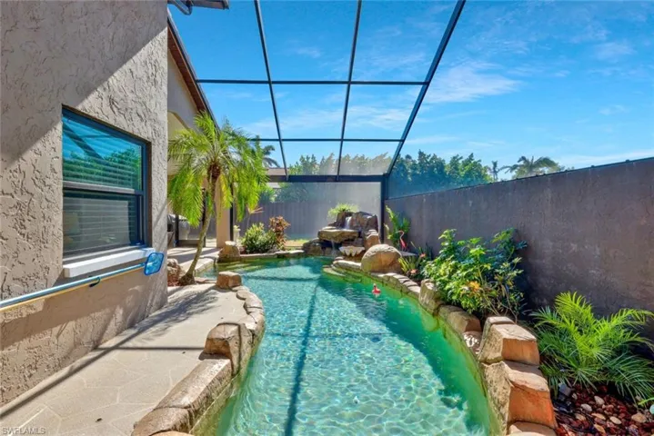 View of swimming pool with pool water feature