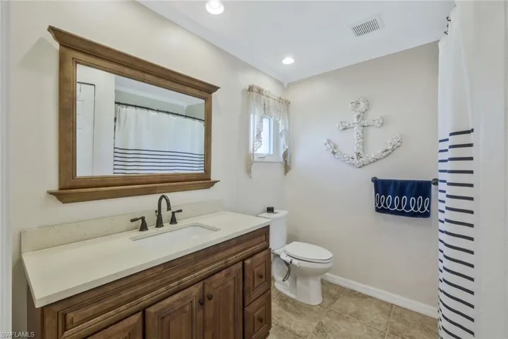 Bathroom featuring vanity and toilet