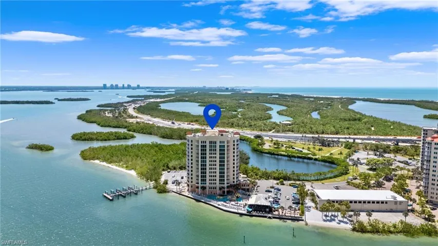 Birds eye view of property featuring a water view