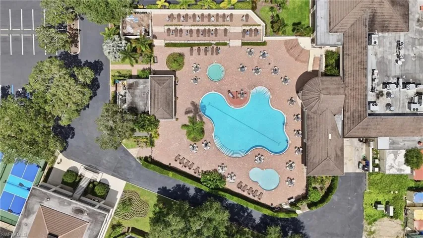 Expansive pool deck with multiple pools and a spa