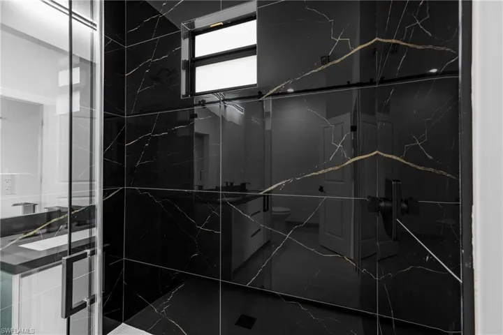 Interior details with toilet and a shower with door