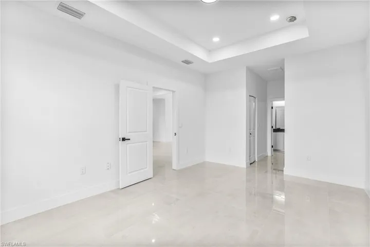 Spare room featuring a raised ceiling