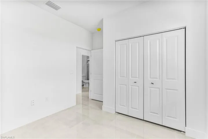 Unfurnished bedroom with a closet