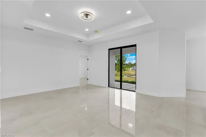 Spare room featuring a raised ceiling