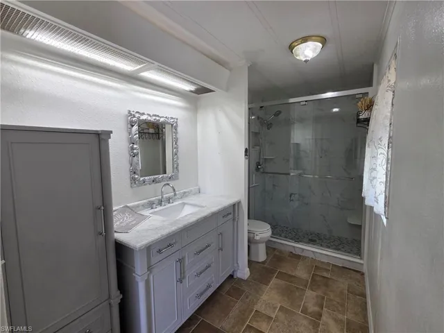 Updated Primary Bathroom with tiled shower.