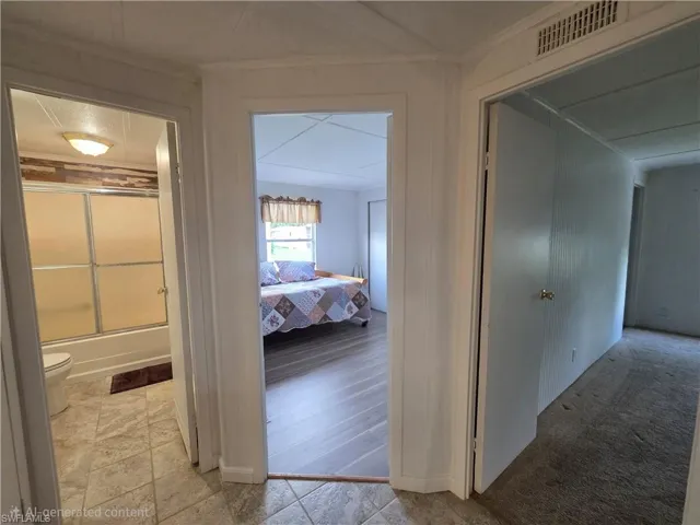Hall Bath, Guest Bedroom, & entrance to Primary Suite