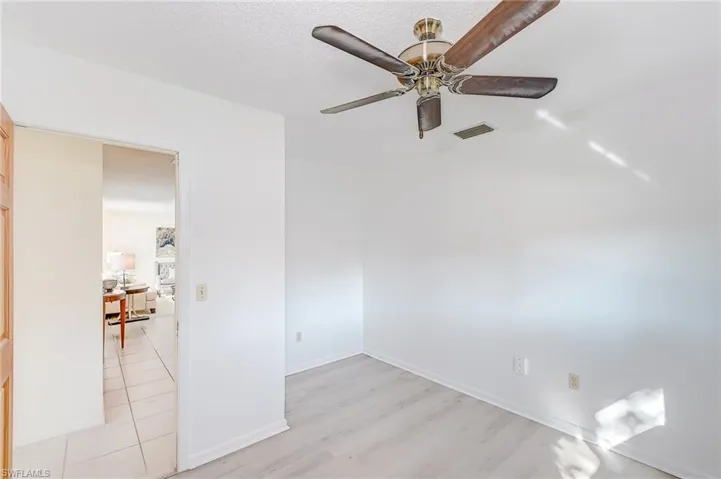 Spare room featuring light hardwood / wood-style flooring and ceiling fan