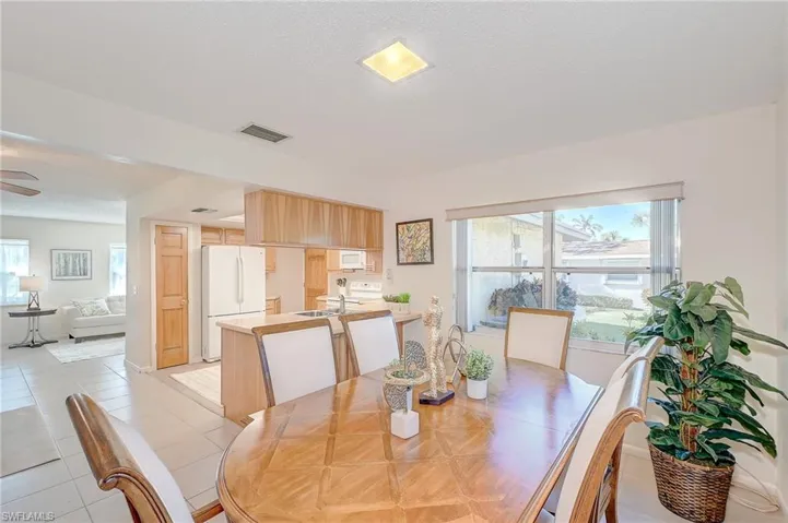 Dining room featuring ceiling fan and light tile patterned floors
