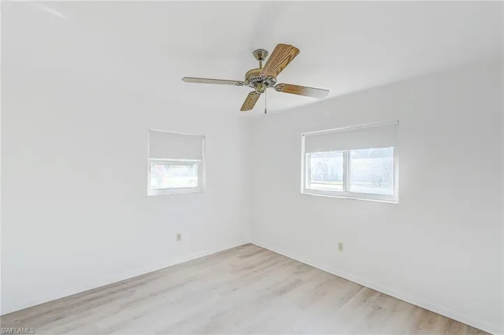Spare room featuring light hardwood / wood-style flooring and ceiling fan