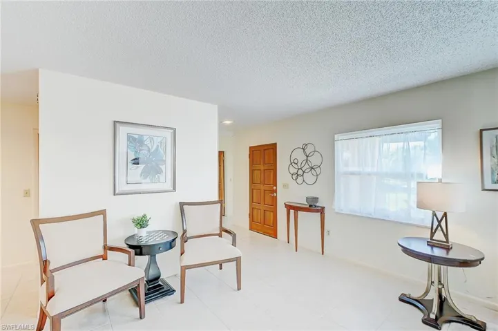 Living area featuring a textured ceiling