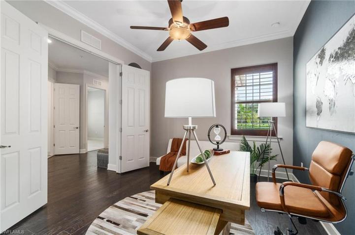 The 4th bedroom is situated in its own wing upfront with double door entry. It is staged as a den/office