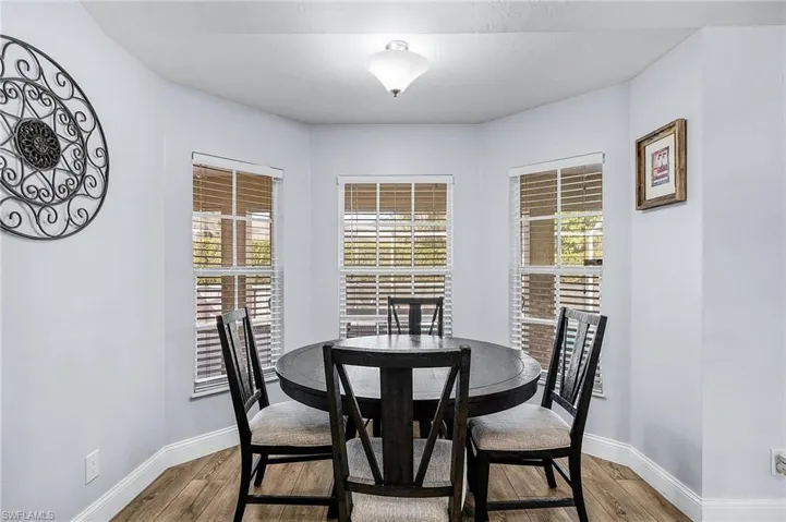 Dining space with wood-type flooring