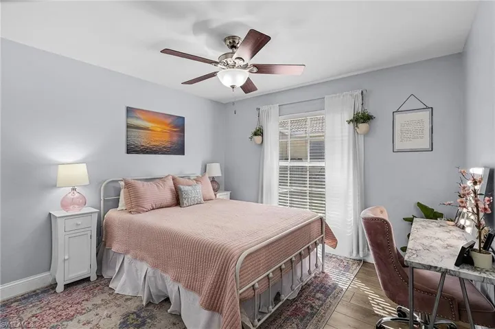 Bedroom featuring hardwood / wood-style floors and ceiling fan