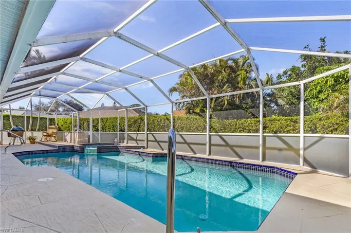 View of pool featuring a patio and a lanai