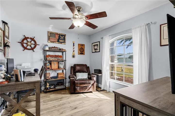 Office featuring ceiling fan and light hardwood / wood-style floors