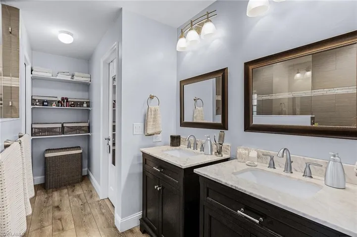 Bathroom with vanity and wood-type flooring