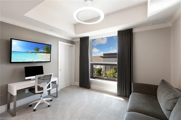 Office featuring ornamental molding and carpet floors