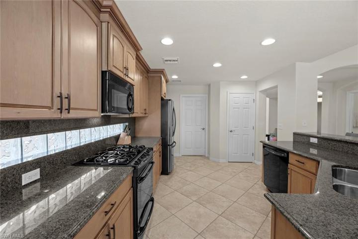 Pantry behind door on right, laundry room w/2 storage areas behind door on left