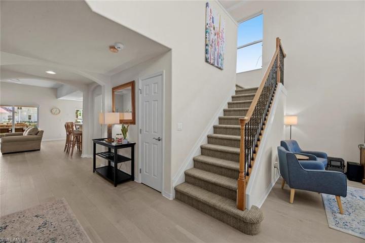 Coat closet next to staircase