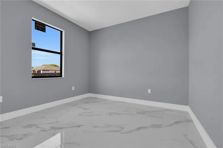 Empty room with marble look tiles
