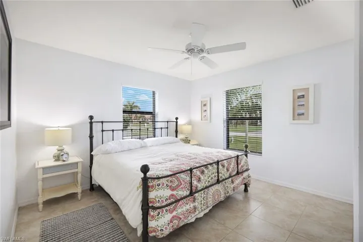 Bedroom featuring ceiling fan and light tile patterned floors