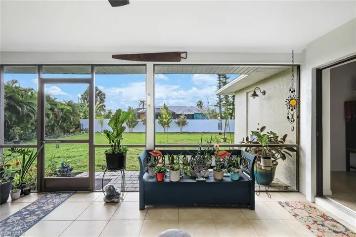 Sunroom with tile patterned flooring