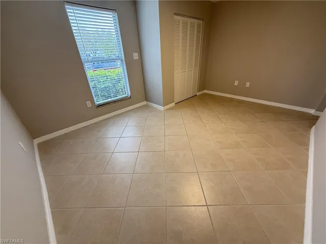 Unfurnished 3rd bedroom featuring a closet and light tile patterned flooring