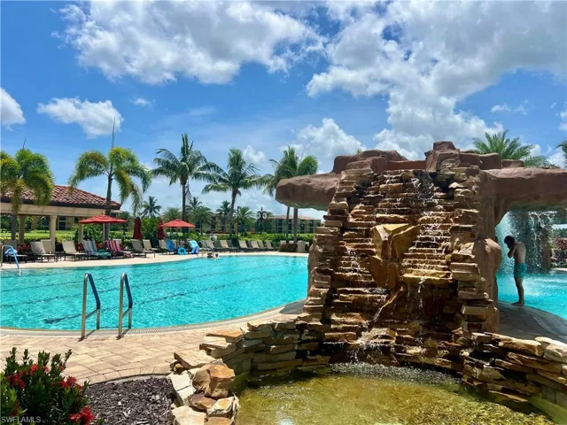 Community pool with a patio