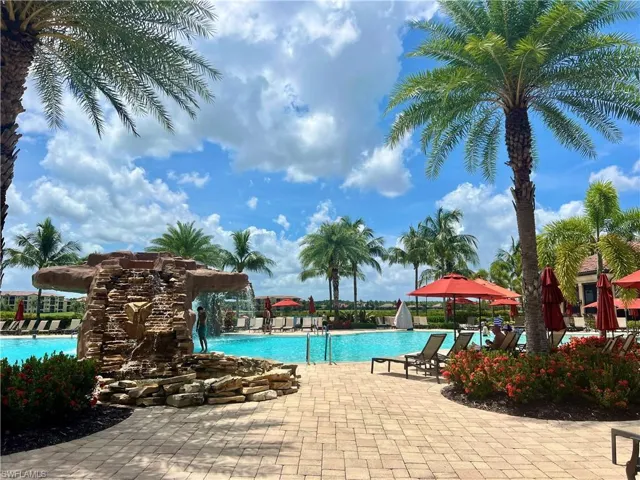 Community pool with a patio area