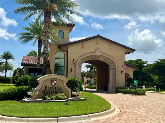 Community sign with curved driveway