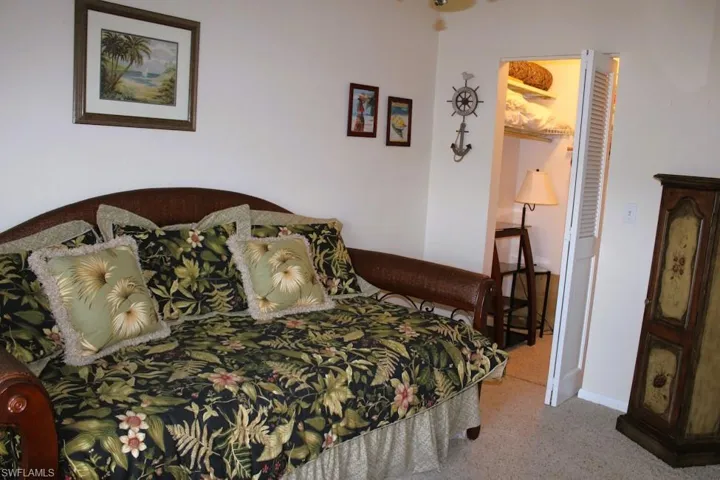 Carpeted bedroom with baseboards