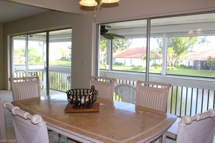 Dining area with a ceiling fan and plenty of natural light